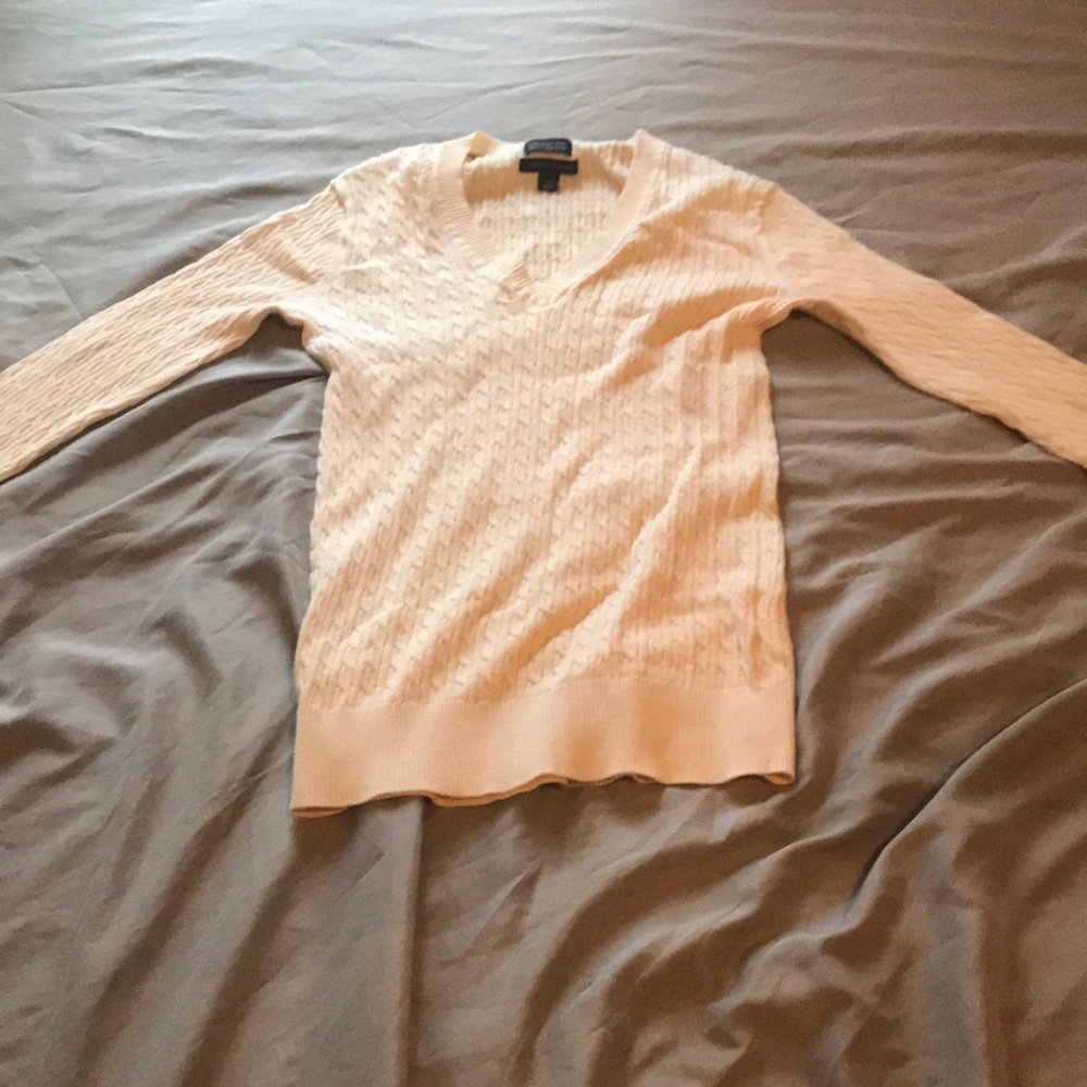 A Tommy Hilfiger sweater in cream